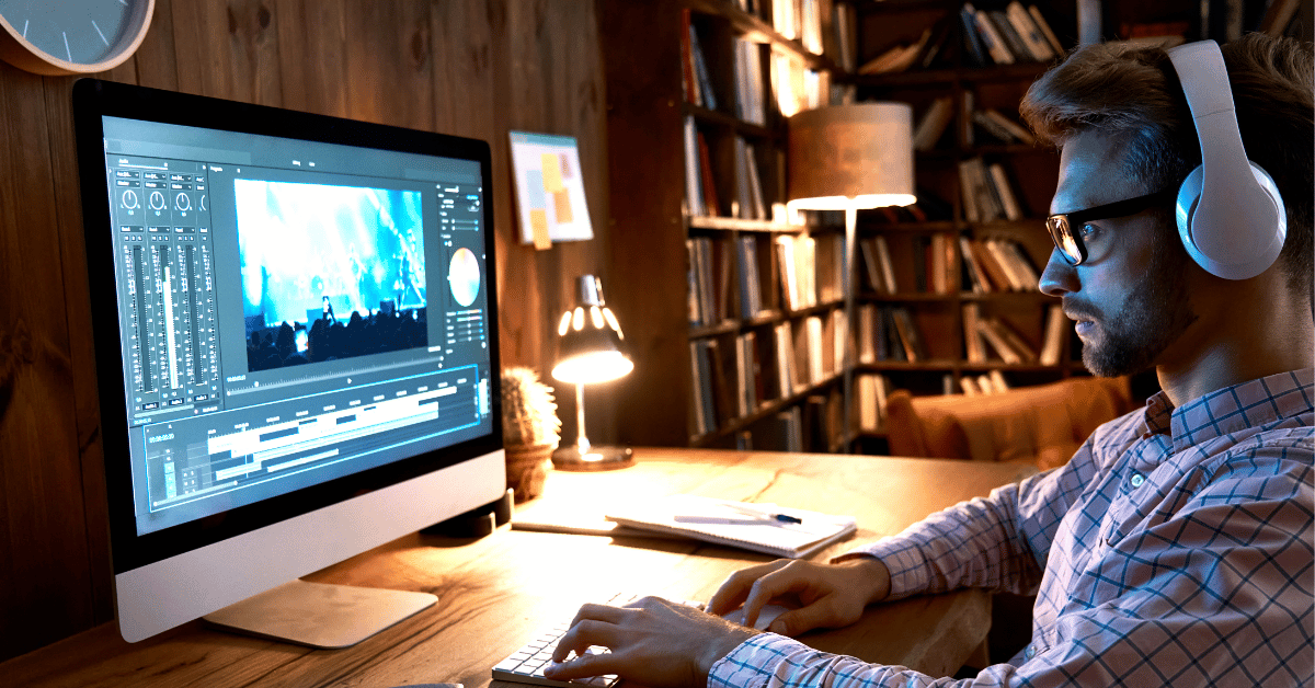 male working on his film wearing headphone