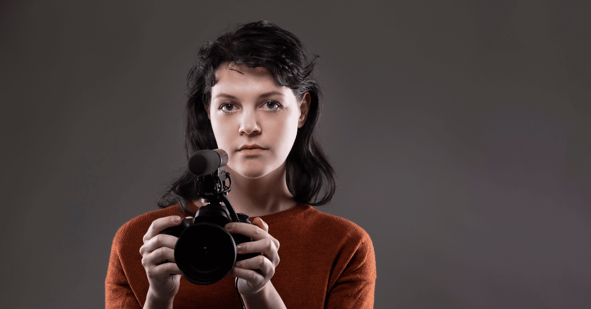 female holding her camera