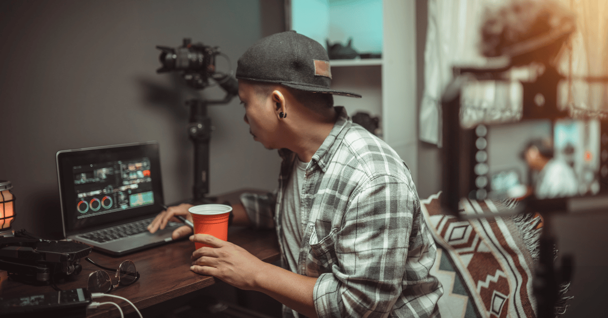 male working on his laptop on a new soundtrack